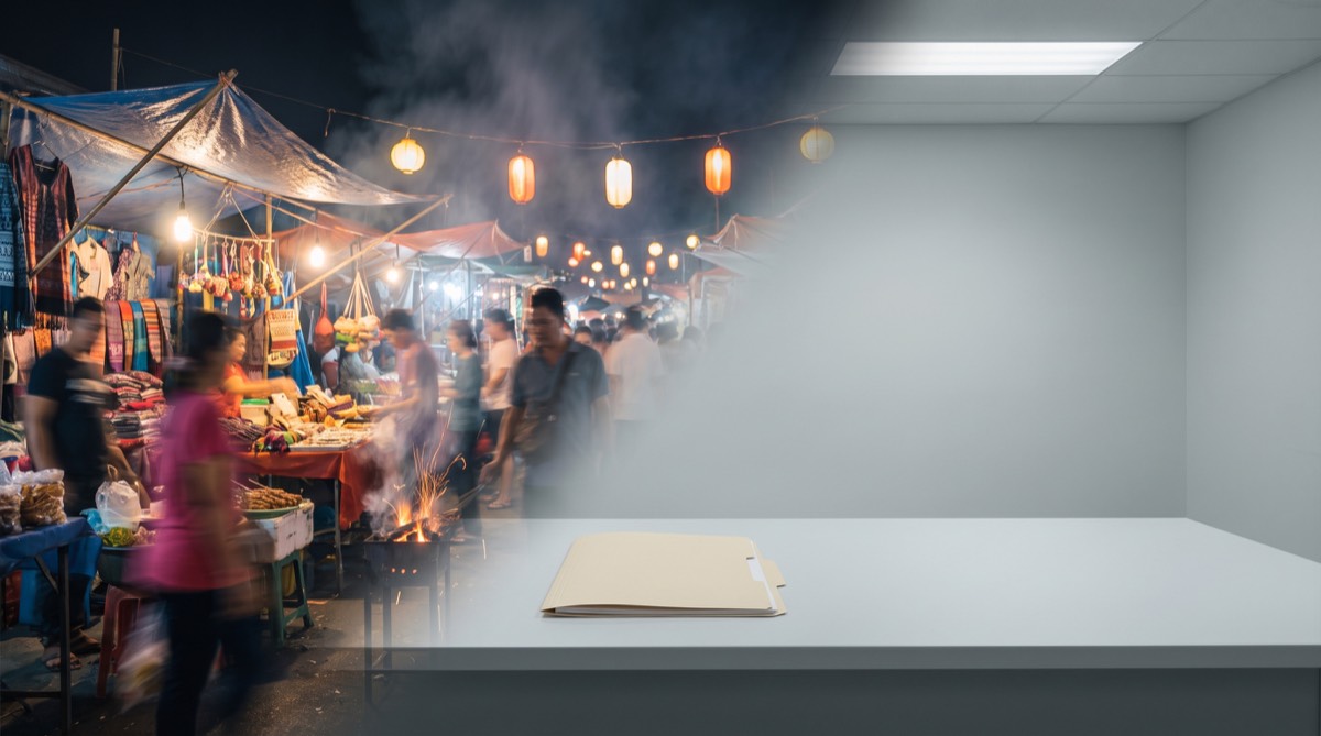 A bustling handmade night market dissolves into an empty administrative desk with a single beige folder.